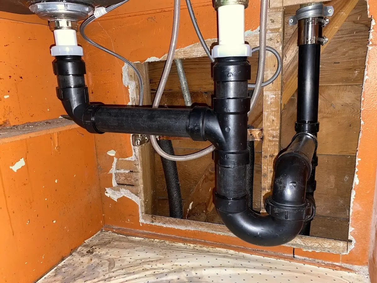 Professional Garbage Disposal Repair equipment and tools on the job in Ault